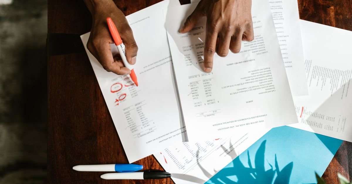 Financial documents and calculator used for a contractor license application