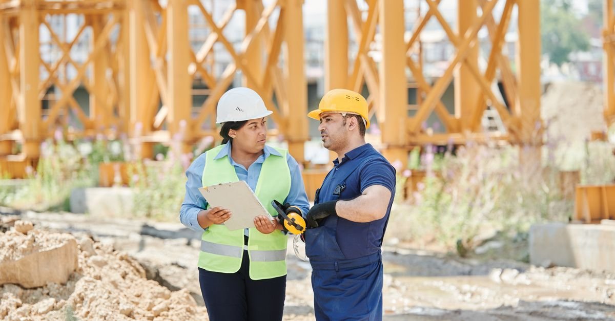 Contractor completing licensing application paperwork at a desk